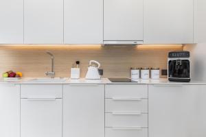 Kuchyň nebo kuchyňský kout v ubytování Premium Apartament PINEA Pobierowo