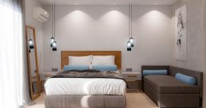 Un pat sau paturi într-o cameră la Hotel Aethria