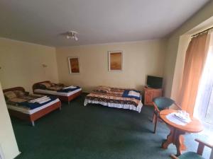 Posteľ alebo postele v izbe v ubytovaní OWR Relax - Hostel położony blisko atrakcji turystycznych