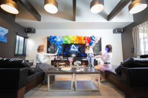 three girls sitting in a living room with balloons at Maebashi - House - Vacation STAY 64426v in Maebashi