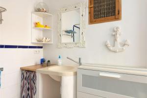 a bathroom with a sink and a mirror at Ca Na Velutina - Can Picafort in Can Picafort +23 photos