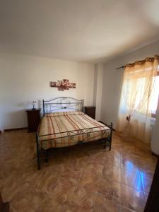 a bedroom with a bed in a room at Albergo Bar Ristorante Vecchio Mulino in Bobbio