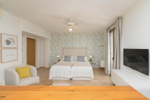 A bed or beds in a room at iloftmalaga Carretería - Puerta de Antequera