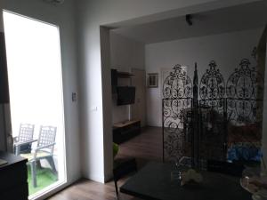 a living room with a door to a living room at Salentino in Lequile