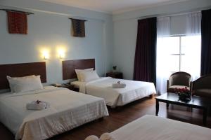 Katil atau katil-katil dalam bilik di Hotel Maluri