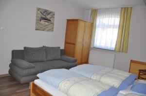 Ein Bett oder Betten in einem Zimmer der Unterkunft Seevilla Wietjes Whg 5