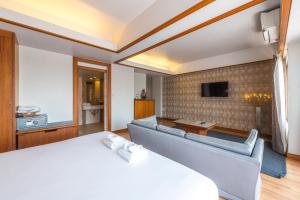 Postel nebo postele na pokoji v ubytování Nonthaburi Palace Hotel