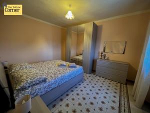 a bedroom with a bed and a dresser and a mirror at Yellow Corner in Bagni di Lucca +7 photos