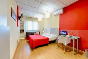Een bed of bedden in een kamer bij OK Hoteles Estudios Plata