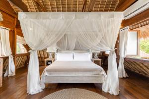 Postel nebo postele na pokoji v ubytování Tigerlillys Boutique Hotel