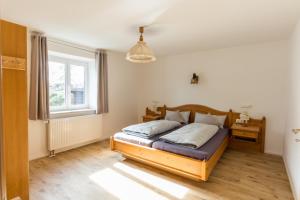 Postel nebo postele na pokoji v ubytování Ferienwohnung Sophie + 3 fotografie