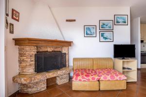 Un televizor și/sau centru de divertisment la Appartamento Bellavista +13 fotografii