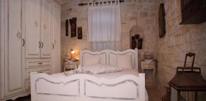 Posteľ alebo postele v izbe v ubytovaní Villa Athina - Irene Country House