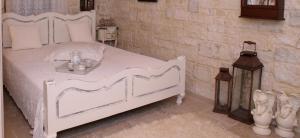 Posteľ alebo postele v izbe v ubytovaní Villa Athina - Irene Country House