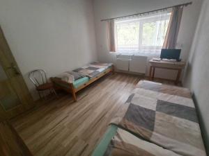 Postel nebo postele na pokoji v ubytování Motel Šofér