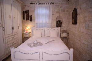 Posteľ alebo postele v izbe v ubytovaní Villa Athina - Irene Country House
