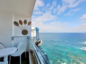 a view of the ocean from the balcony of a condo at Coastal Vibe in Tacoronte