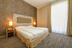 Voodi või voodid majutusasutuse Hotel Flaminia toas