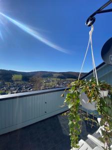 a balcony with a view of a city at Ferienwohnung An der Spitze in Winterberg