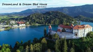 an aerial view of a castle on a lake at DREAM Bled Apartments in Bled
