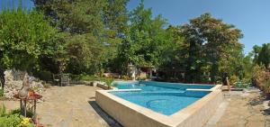 a large swimming pool in a yard with at Adventure Camp Emen in Emen