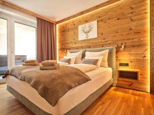 Voodi või voodid majutusasutuse The Spa Suite Top 3- Tauplitz Residences by AAHH toas
