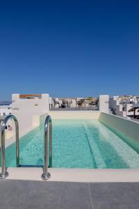 a swimming pool on the roof of a building at Ampelos Residence Naxos in Naxos Chora