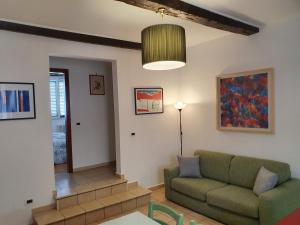 a living room with a couch and a table at Giulia House via dell Ariento 5 Firenze in Florence