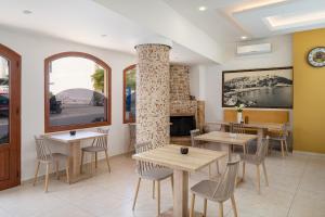 A restaurant or other place to eat at Minos Boutique Hotel