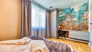 Posteľ alebo postele v izbe v ubytovaní Apartamenty Piano by Royal Aparts