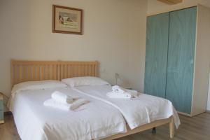 Postel nebo postele na pokoji v ubytování Albergo Croce d'Aune