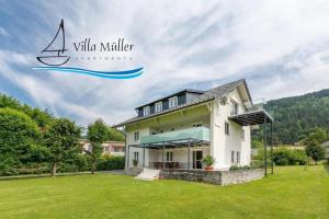 a villa with a view of a house at Villa Müller Rotfuchs in Ossiach