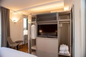 Letto o letti in una camera di Padova Suites C20