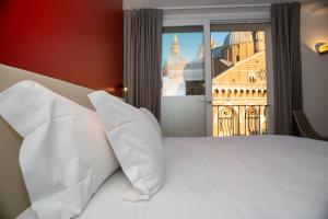 Letto o letti in una camera di Padova Suites C20