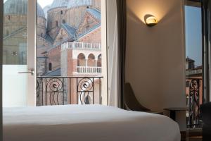 Letto o letti in una camera di Padova Suites C20