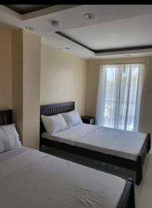 En eller flere senge i et værelse på Nine Balconies Island Stay