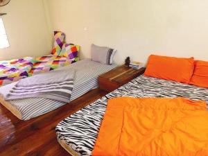 Postel nebo postele na pokoji v ubytování Bao Loc Homestay