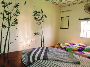 Postel nebo postele na pokoji v ubytování Bao Loc Homestay