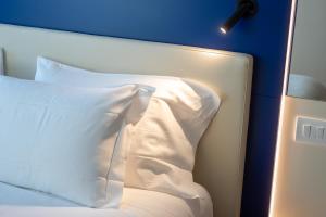 Letto o letti in una camera di Padova Suites C20