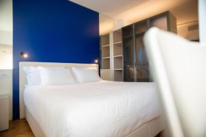 Letto o letti in una camera di Padova Suites C20
