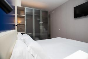 Letto o letti in una camera di Padova Suites C20