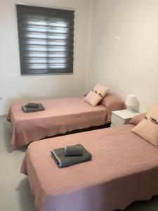 A bed or beds in a room at Avenida central