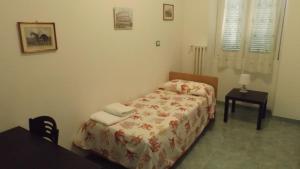Posteľ alebo postele v izbe v ubytovaní Foresteria Roma Esercito della Salvezza