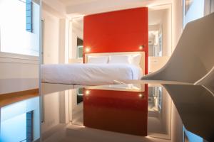 Letto o letti in una camera di Padova Suites C20