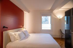 Letto o letti in una camera di Padova Suites C20