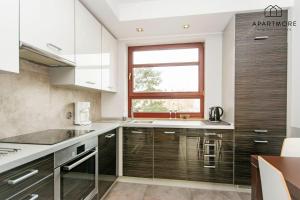 Kuchyňa alebo kuchynka v ubytovaní City Center - Torunska 18 by Apartmore