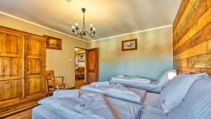 Posteľ alebo postele v izbe v ubytovaní Aparthotel STARA PIEKARNIA by ROYAL APARTS