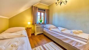 Posteľ alebo postele v izbe v ubytovaní Aparthotel STARA PIEKARNIA by ROYAL APARTS
