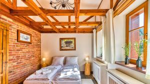 Posteľ alebo postele v izbe v ubytovaní Aparthotel STARA PIEKARNIA by ROYAL APARTS