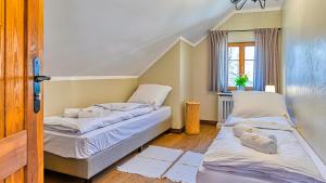 Posteľ alebo postele v izbe v ubytovaní Aparthotel STARA PIEKARNIA by ROYAL APARTS